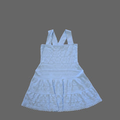 Light blue dress on a tiled floor