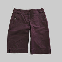Pair of purple shorts on a light background