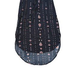 Black dress with white and pink patterns on a light background