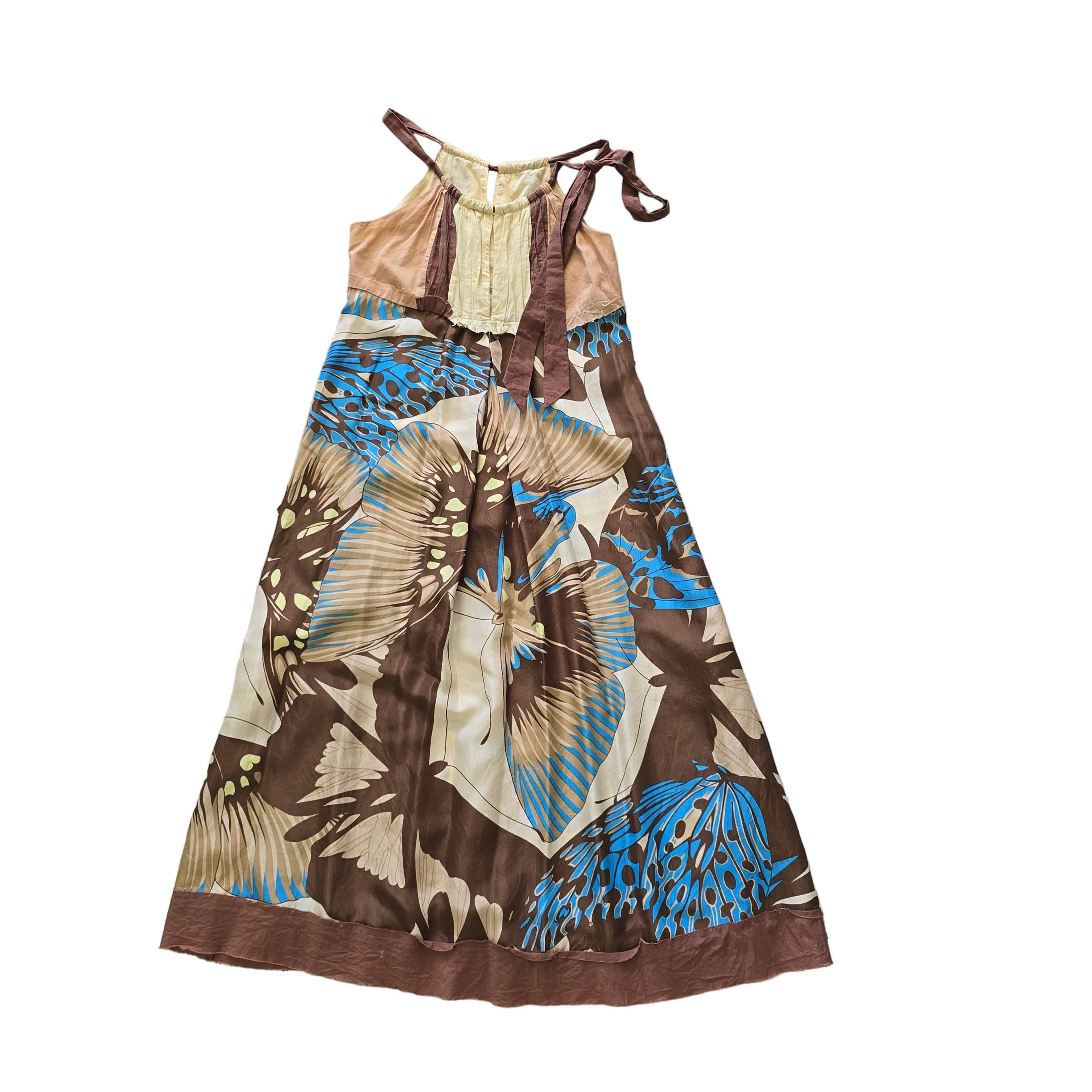 Butterfly patterned dress on a tiled floor