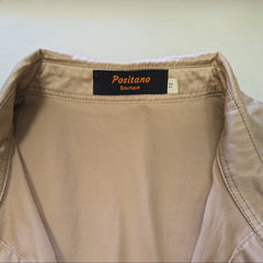 Beige top with a 'Positano Boutique' label on a white background